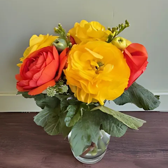 Vase flowers with yellow and pink